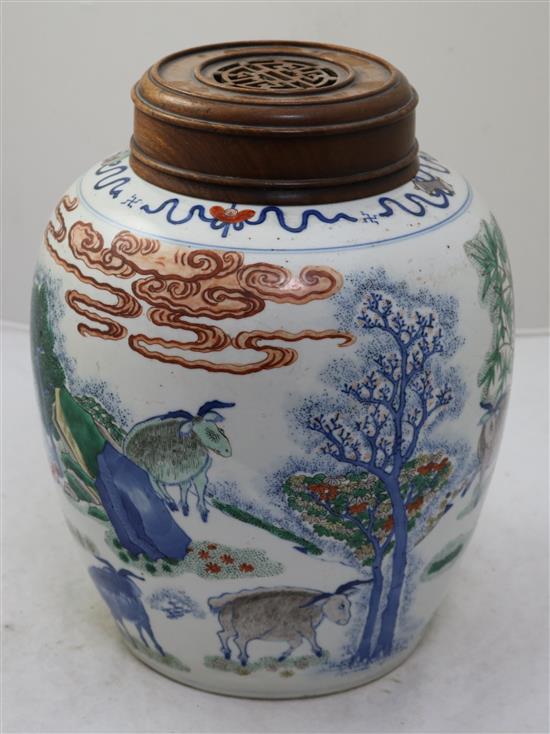 A large Chinese wucai ovoid jar, 19th century, height 27.5cm, rosewood cover and stand, crack to base